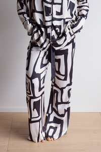 Relaxed fit pyjama pants made from silky, breathable bamboo in a bold geometric print with black and cream colours.